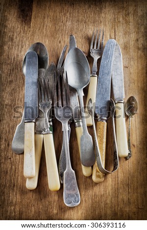 old vintage cutlery on a wooden table