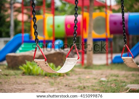 Playground and swings in colorful park