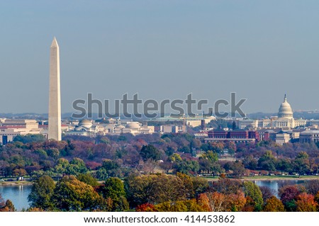 The Washington Monument and United States Capitol Building stand tall amongst the fall landscape of Washington D.C.