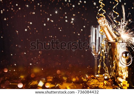 Sparkling New Year background. Champagne Explosion With Toast Of Flutes
