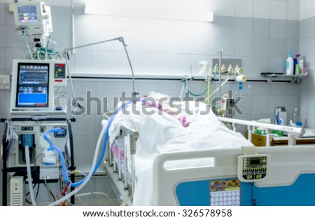 ICU room in a hospital with medical equipments and patient