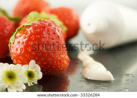 Cream for body care with strawberries