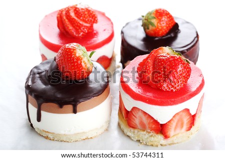 Assorted cakes with fresh strawberries