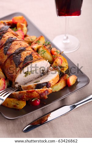 Roast pork with sage and thyme sauteed potatoes and spiced apple sauce