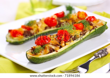 Zucchini stuffed with meat, onions and vegetables