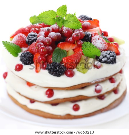 Cake with fresh fruits isolated on white background, soft focus