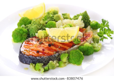 grilled salmon with broccoli and cauliflower on white plate