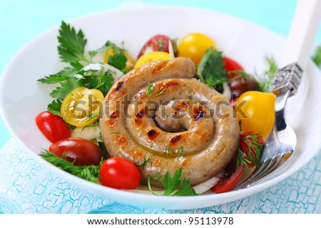 Grilled sausages with salad of tomato-colored on white plate - stock ...
