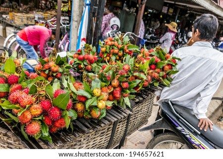 SIEM REAP, CAMBODIA- SEPT 21: The bustling market traders in the local food markets September 21st  2013, Siem Reap. The local population gather to buy their food fresh for the day. the