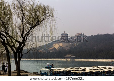 BEIJING, CHINA-MARCH 2014:-The summer palace bathed in Smog, home for the Dragon Lady, March 2014 in Beijing. The summer Palace was used as a beautiful prison for the empress Dragon ladys Nephew.