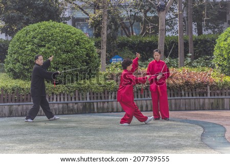 SHANGHAI, CHINA - 28th MARCH 2014: Nanjing road where people practice Tai Chi in the mall every morning