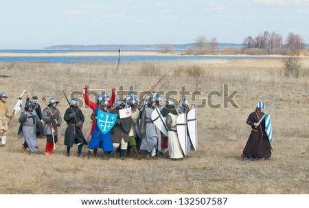 SAMOLVA, RUSSIA - APRIL 22: historical reconstruction of the Battle on the Ice, member(s) dressed in medieval armor on April 22, 2012 in village Samolva near Pskov, Russia.