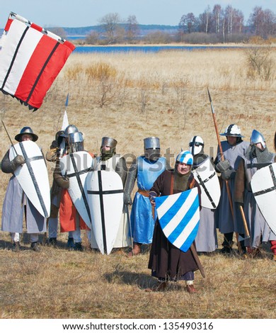 SAMOLVA, RUSSIA - APRIL 22: historical reconstruction of the Battle on the Ice, member(s) dressed in medieval armor on April 22, 2012 in village Samolva near Pskov, Russia.