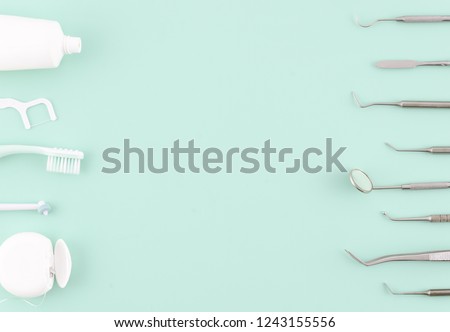 Dentist tools. Teethcare, dental health concept. Light blue background top view copy space flat lay. Teeth care fresh breath