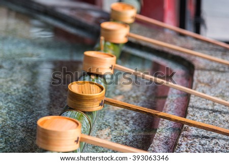 Close up of japanes wooden ladle in shrine yufuin kyushu japan.