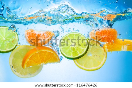Tropical Fruits Fall Deeply Under Water With A Big Splash