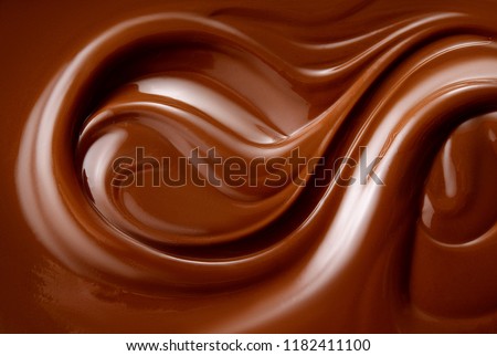 Chocolate background. Melted chocolate. Chocolate swirl.