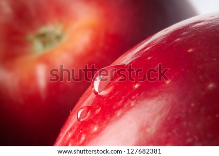 red wet apple with big drops. macro shot