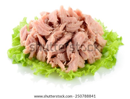 Tuna. Canned fish on green lettuce leaf