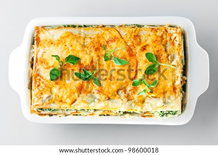 Spinach lasagna with basil and oregano Isolated.
