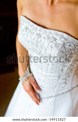 A caucasian bride in her flower pattern wedding dress in natural light
