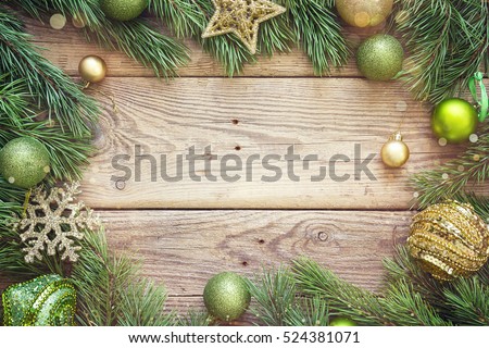 Christmas background with fir branches and decorations. Space for text. Top view.