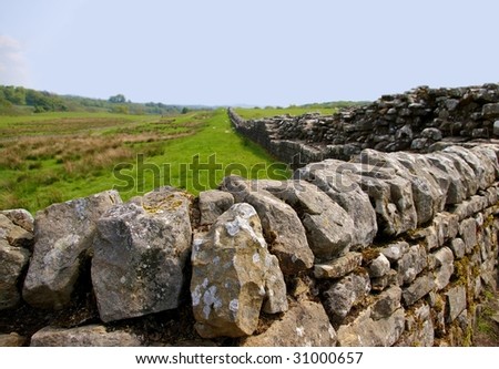 Hadrian\'s Wall, ancient roman drystone, disappearing towards the horizon