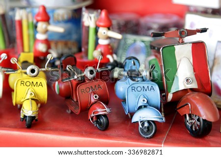 Vespa, scooter. Close-up of miniatures hand made toys motorcycles.\
Italian symbols.