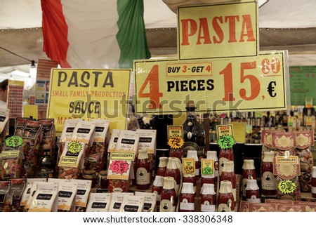 ROME, ITALY - NOVEMBER 07 2015: Italian products under the italian flag are displayed on a stall at outdoor market in Rome, Italy