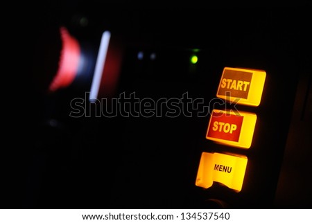 start stop menu button in close-up and red brake button