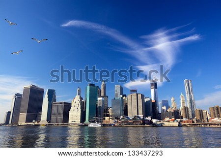 Lower Manhattan urban skyscrapers and Seaport over East River, New York