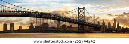 Philadelphia skyline panorama and Ben Franklin Bridge at sunset, USA