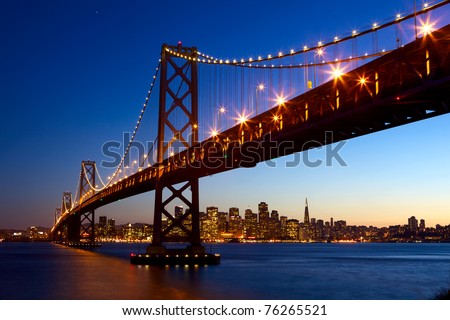 San Francisco skyline and Bay Bridge at sunset, California, USA