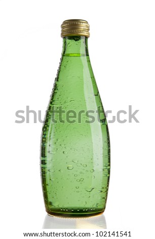Green Glass bottle of soda water. Isolated on white background