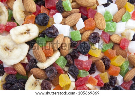 Candied fruits Pile of toasted nuts and candied fruit isolated on white background