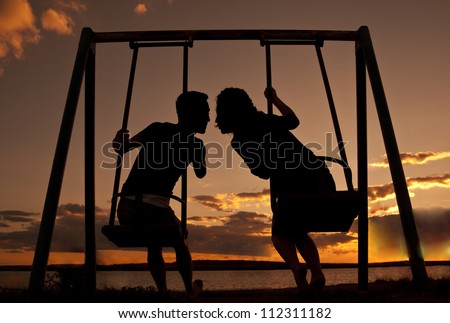 kissing on swing