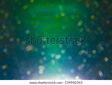 wallpaper with abstract round shaped transparent green and blue lights