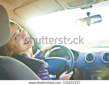Woman In Car Indoor Keeps Wheel Turning Around Smiling Looking At Passengers In Back Seat Idea Taxi Driver Talking To Police Companion Companion Who Asks For Directions Right To Drive And Documents