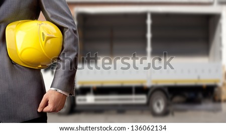 engineer yellow helmet for workers security over empty truck for transportation