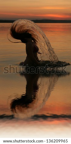 sunset yoga woman on sea coast with reflection  Silhouettes of young girl jumping in ocean at sunset