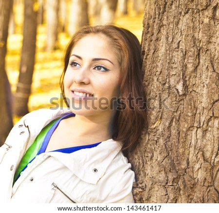 Outdoors portrait of colorful clothed gorgeous fall fashion latin hispanic girl. Copy Space for inscription