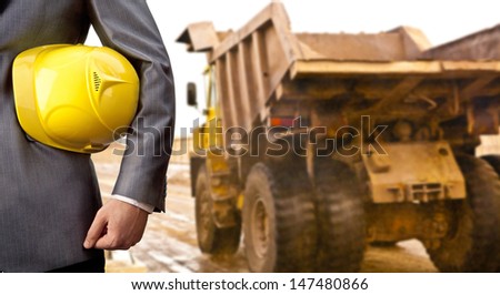 engineer yellow helmet for workers security construction worker showing thumb up smiling in beside truck