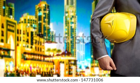 engineer yellow helmet for workers security over two high-rise buildings