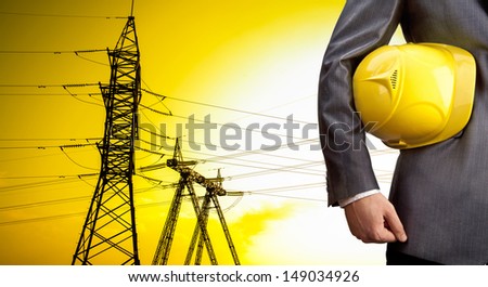 engineer yellow helmet for workers security over high voltage power line  Copy space for inscription Outdoors