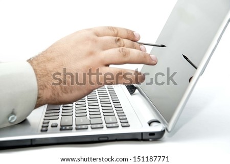 Graphic designer working in office with no face recognizable here. focus on digital pen with reflection on screen Isolated on white background