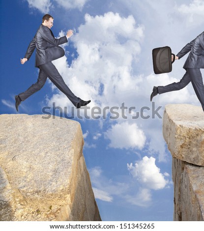 Business young Man jumping over mountains Copy Space for inscription symbol of overcoming obstacles effort new level from one edge abyss empty and on other with case  symbol good luck acquisitions