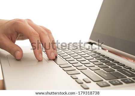 Business male hands writing on white laptop Isolated on white background man using a computer whilst holding in hand