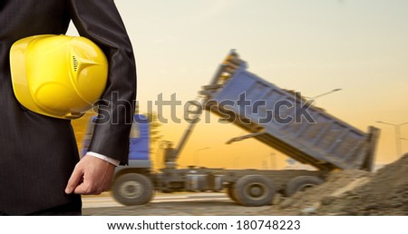 torso and hand engineer yellow helmet for workers security construction worker in beside truck Falling out of the land of a lorry No face Unrecognizable person