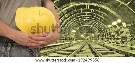 Construction worker hands holding yellow plastic helmet isolated on white background   keep hard hat close-up