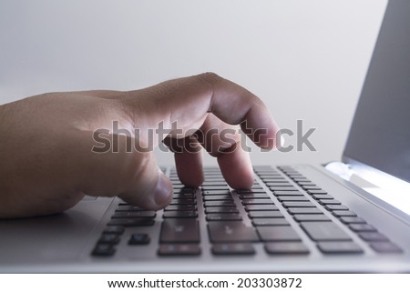 shot of men hands typing text on laptop No face Unrecognizable person Copy space for inscription